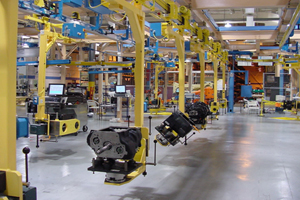 LogiTrack automated electrified monorail transferring engines through assembly operations.